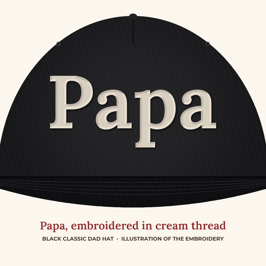 Papa embroidery close-up in cream thread on a black dad hat (illustration of the embroidery)