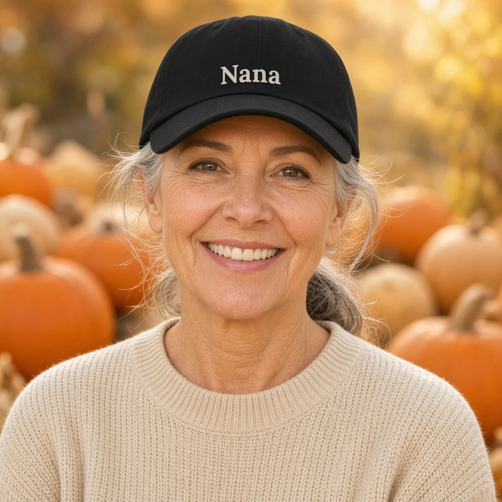Nana embroidered black dad hat worn at a pumpkin patch — lifestyle photo with the real embroidery design