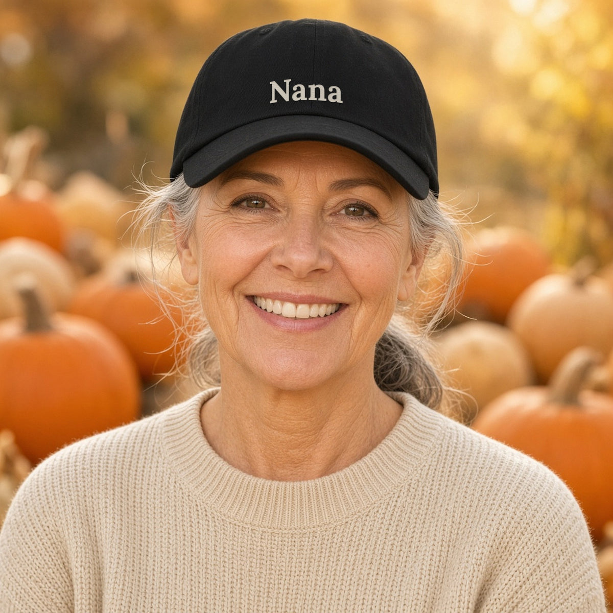 Nana embroidered black dad hat worn at a pumpkin patch — lifestyle photo with the real embroidery design