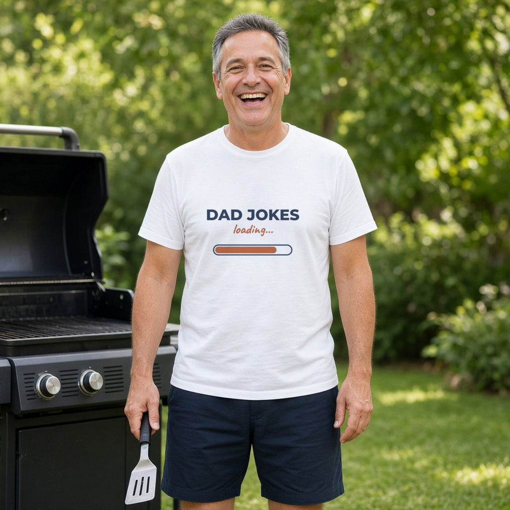 Dad Jokes Loading t-shirt (White) worn at a backyard grill — lifestyle photo with the real print design